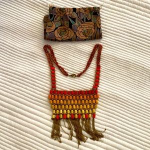 Lightly worn statement necklace with colorful threading and chain tassels.